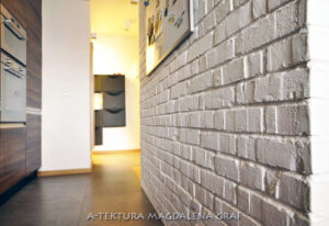 Ścianka z białej cegły, projekt mieszkania, detal